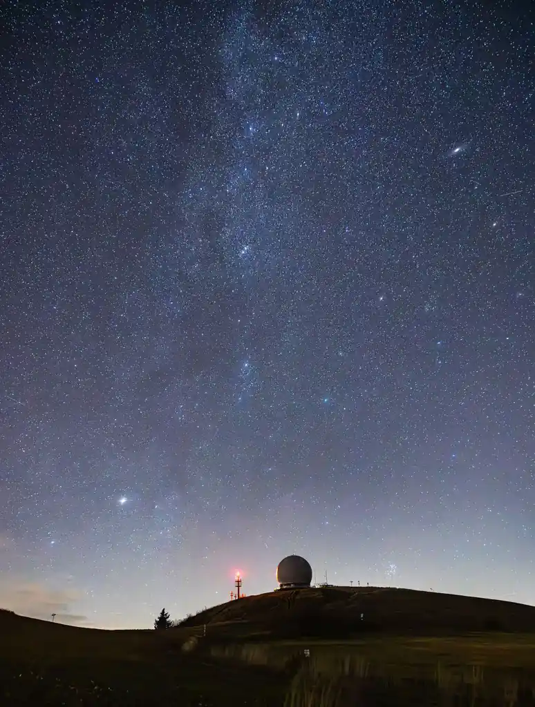 Observatory dome under a star-filled sky